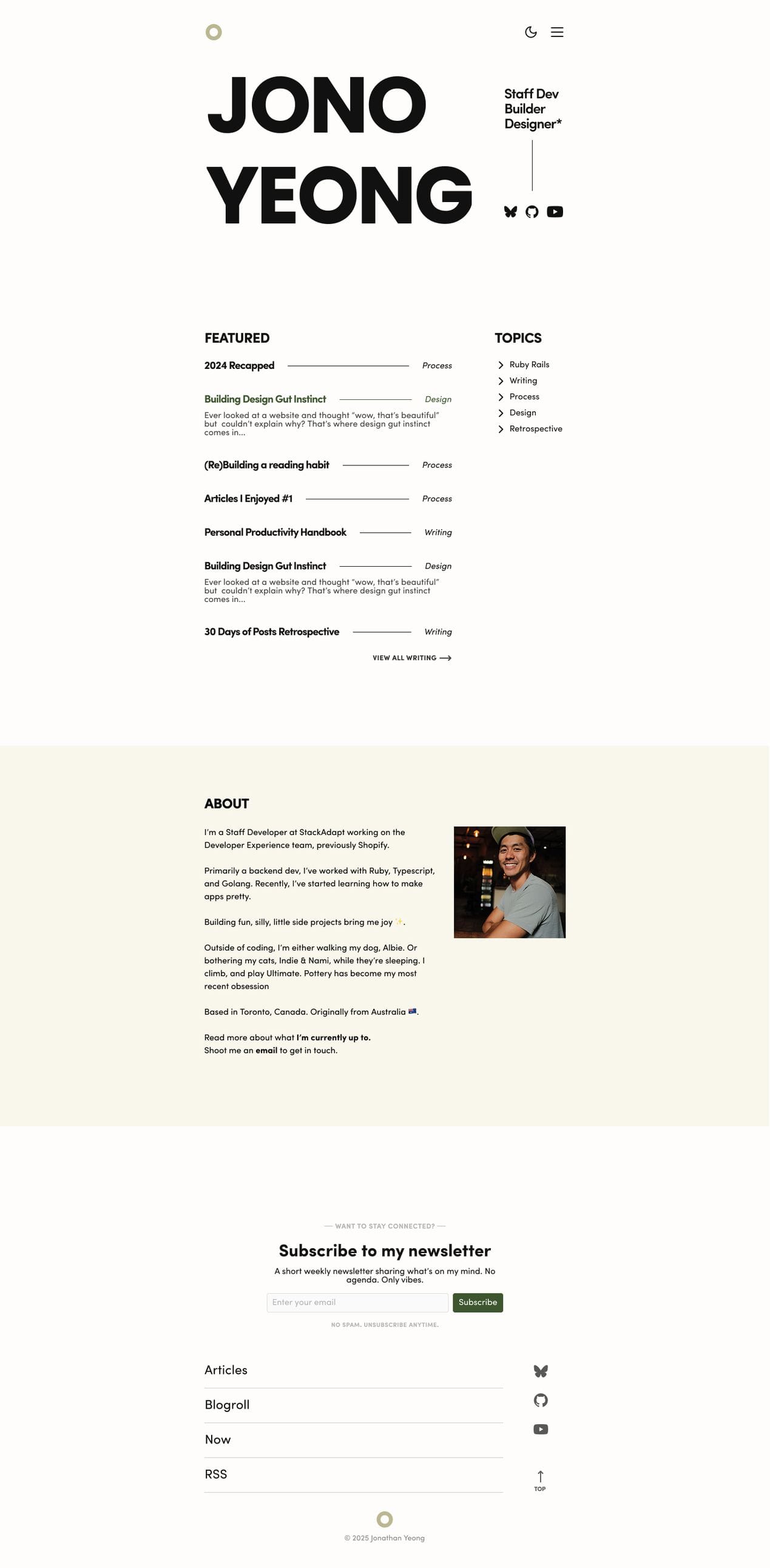 Homepage design with large hero text that fills the container. Contains featured, topics, and about section. As well as a newsletter cta
